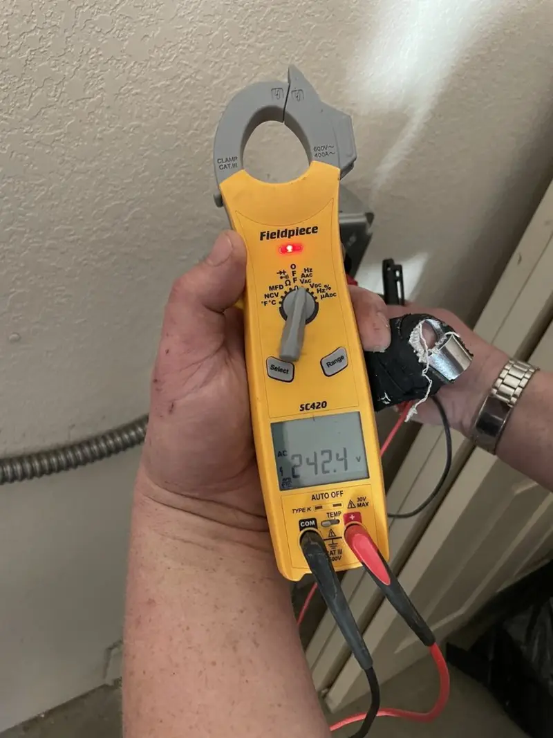 Voltage testing with clamp meter during Recessed Lighting Installation in Greenbrier